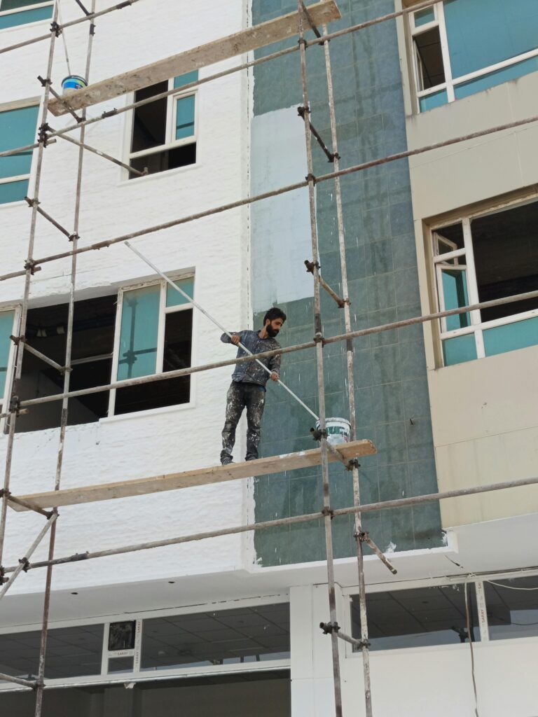 Commercial building exterior painting.
